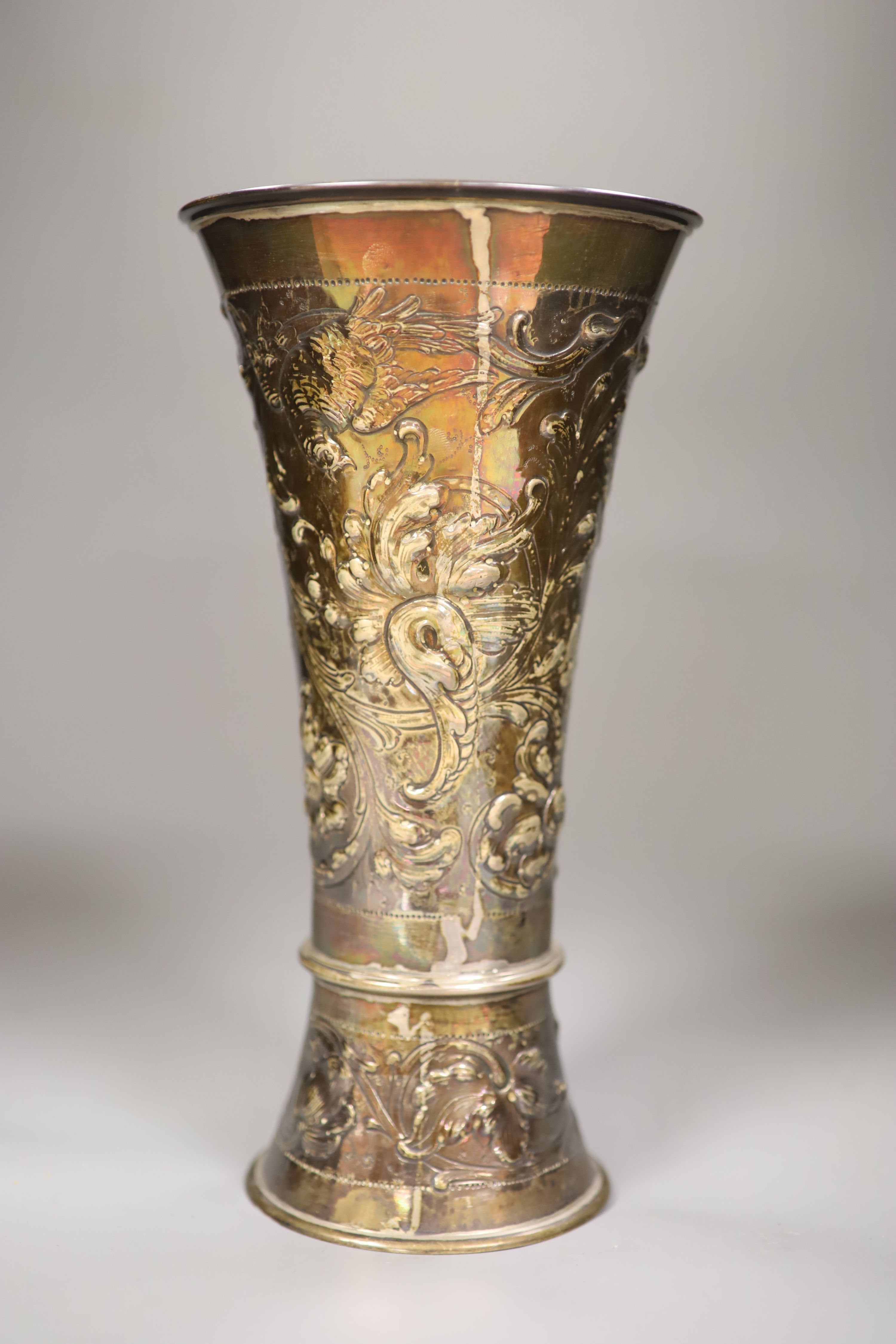 A late 19th century Hanau embossed white metal vase with, London 1897 import mark, decorated with birds and flowers,